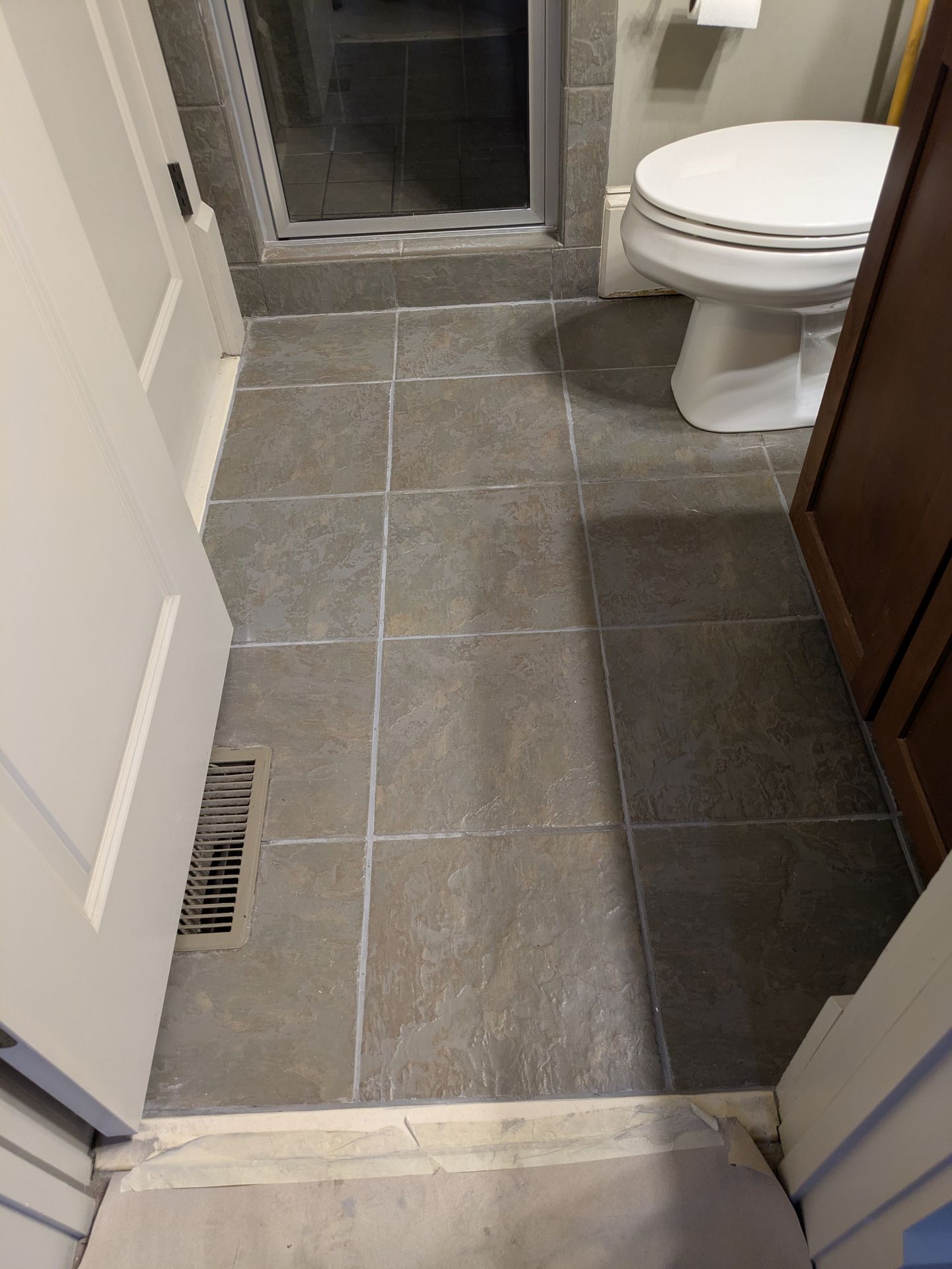 Clean grey floor tile in a finished Athens bathroom remodel
